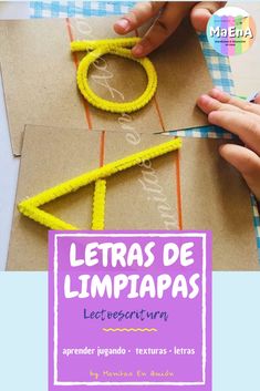 a person cutting out letters with scissors on top of a piece of paper that says letras de limpiapass