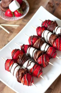 chocolate covered strawberries on skewers with toothpicks