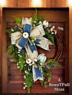 a beautiful wreath with blue and white flowers