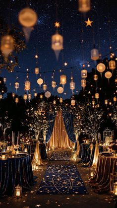 an outdoor wedding venue with lanterns hanging from the ceiling