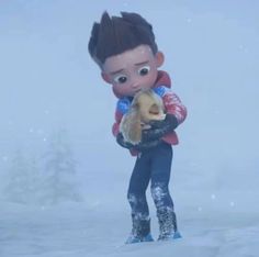 a young boy holding a stuffed animal in the snow