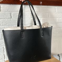 Nwt Tote Bag With Dual Carry Handles, Topstitching + Seaming Details And Embossed Ck Monogram Logo On The Front. 13.4" Wide X 15.4" Tall X 4.7" Deep Black Pouch Bag With Leather Handles, Black Leather Calvin Klein Bag, Calvin Klein Shoulder Bag For Shopping, Calvin Klein Black Shoulder Bag For Daily Use, Calvin Klein Rectangular Bag With Removable Pouch, Calvin Klein Leather Shoulder Bag With Removable Pouch, Calvin Klein Black Shoulder Bag With Removable Pouch, Everyday Rectangular Calvin Klein Shoulder Bag, Calvin Klein Black Shoulder Bag For Shopping