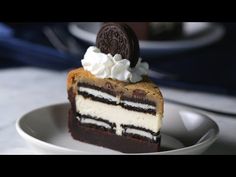 a piece of cake with oreo cookies on top is sitting in a white bowl