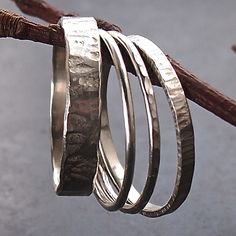 Four sterling silver textured rings come together in one beautiful stack. There is a heavily textured 4mm band, a 2mm bark textured band and two skinny rings, one hammered and the other is polished and plain. Perfect for those who like to get creative and want to mix it up a bit!  Please remember to tell us what size you would like us to make your rings - just leave message at the checkout. You may want to add 1/2 a size o to allow for the width of the stack as they do tend to feel a bit tighter Stacking Rings Silver, Silver Stacking Rings, Textured Ring, Silver Bangle Bracelets, Get Creative, Curated Gifts, Jewelry Inspo, Come Together