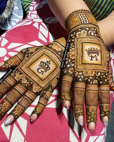 a woman's hands with hennap painted on them