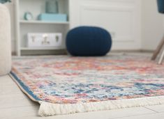 a colorful rug on the floor in a living room