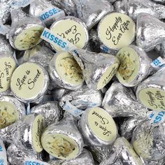 hers kisses are wrapped in foil and have writing on the top, as if they were for valentine's day