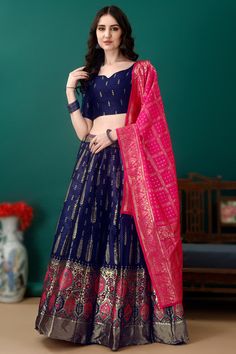 Sway away everyone with your simplicity as you wear this dark blue art silk lehenga which will instantly catch your fancy.This sweetheart neckline and half-sleeve blouse is embellished in woven zari work.Teamed up with art silk panelled style lehenga in dark blue color with ruby pink art silk dupatta.Panelled style lehenga has weaved zari work.Dupatta highlighted with weaved zari work.This lehenga blouse can be customized up to the maximum size available in inches 44. Slight color variation may occur due to photographic reasons. Dark Blue Art, Jacquard Lehenga, Lehenga Blouse, Half Sleeve Blouse, Zari Work, Silk Lehenga, Silk Dupatta, Dark Blue Color, Pink Art