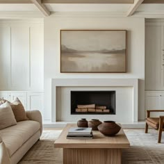 a living room filled with furniture and a fire place in the middle of a room