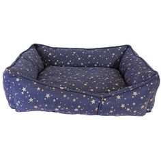 a blue dog bed with gold stars on the front and bottom, it is made from fabric