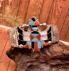 WOW, what a beautiful piece of jewelry this is.  Inlaid with turquoise, lapis, coral, and mother of pearl this bracelet also has some concho styling.  The cuff is a little flexible to give a good fit. Traditional Luxury Cuff Bracelet With Inlay, Luxury Traditional Cuff Bracelet With Inlay, Stone Inlay, Cake Creations, Bridal Gifts, Cuff Bracelet, Mother Of Pearl, Hippie Boho, Cuff Bracelets