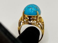 Welcome To Gold Knox Rare vintage 18K yellow gold women's ring with blue cabochon Turquoise. The stone measures 16 mm x 13 mm.Great piece with great details. Details below: Material 18k yellow gold, Turquoise Size 6 US Hallmark 18K This would make great addition to your jewelry collection. Thank you for looking PLEASE, BE SURE TO VIEW THE PICTURES CAREFULLY AND CLOSELY AS IT IS THE EXACT ITEM YOU ARE BUYING. Gold Knox Jewelry opened its storefront in Pasadena, CA in 2011, since then we do our BE Light Blue Gemstone, Buying Gold, Blue Band, Ring Collections, Quality Diamonds, Gold Jewellery, Solid Yellow, Womens Bracelets, Women Rings