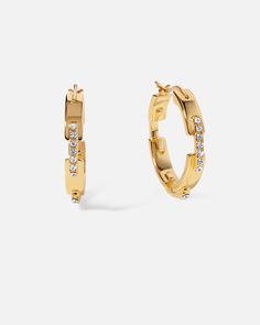 This classic silhouette gets a contemporary upgrade with a unique staple design, making the subversive-basic concept striking and edgy, perfect for any occasion. Sparkling stones collide with a rich, bright polish finish, giving these stapled hoop earrings a geometric linear pattern.
 
Size: 4X23mm
Material: Crystals,18k Gold Plated On Brass Modern Plated Hoop Earrings, Modern Hoop Earrings For Everyday Luxury, Modern Pierced Hoop Earrings For Everyday Luxury, Linear Pattern, Basic Concepts, Earrings In Gold, Classic Silhouette, 18k Gold, Gold Plate