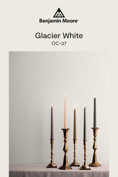 three candles are lined up in front of each other with the words glacier white on them