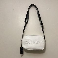 White Dkny Bag New With Tags Everyday White Shoulder Bag With Logo Strap, White Shoulder Bag With Logo Strap For Everyday, White Bags With Logo Strap For Shopping, Chic White Shoulder Bag With Logo Strap, Chic White Bag With Logo Strap, White Bag With Logo Strap For Shopping, White Shopping Bag With Logo Strap, Dkny Crossbody Bag, Unique Lipstick