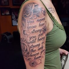 a woman with a tattoo on her arm saying you never know how strong you are