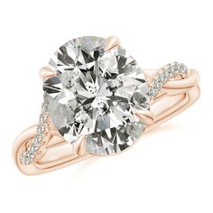 a rose gold engagement ring with an oval cut diamond in the center and side stones