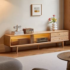 a living room with an entertainment center and coffee table