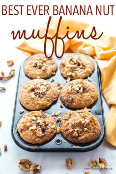 a muffin tray filled with chocolate chip cookies and pecans on a white surface