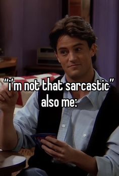 a man sitting at a table holding a plate with the words i'm not that sarcastic also me