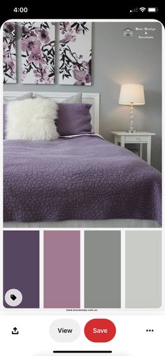 a bedroom with purple and grey colors on the walls