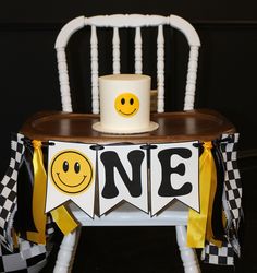 a white chair with a yellow and black one sign on it