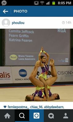 an image of two women doing yoga in the middle of a dance floor with other people watching