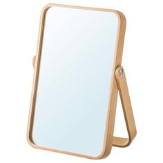 a wooden frame mirror on a white background