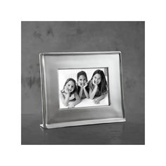 a silver frame with three girls in it