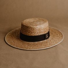 "Looking for a stylish and functional summer accessory? Look no further than this women's straw boater hat. Crafted from high-quality materials using traditional Mexican weaving techniques, this wide-brimmed hat offers a perfect combination of luxury and practicality. Its sturdy construction provides ample protection from the sun's rays, while the airy design keeps you cool and comfortable all day long. With its elegant boater crown and light, natural color, this hat is a must-have for any fashion-conscious woman. And, with the addition of the sleek black Sandoval strap, it's sure to turn heads wherever you go. Upgrade your summer wardrobe with this exclusive and charming hat today. SIZE: MEDIUM Medium (M) = head circumference of 56 - 58.5cm HOW DO I KNOW MY SIZE Discover your size with a Classic Wide Brim Top Hat For Spring, Classic Boater Hat With Curved Brim For Spring, Casual Adjustable Top Hat For Beach, Elegant Spring Sun Hat With Flat Crown, Summer Boater Hat With Adjustable Flat Crown, Classic Top Hat For Beach Outings In Spring, Classic Brimmed Boater Hat For Spring, Classic Spring Top Hat For Casual Beach Outings, Chic Curved Brim Top Hat For Beach