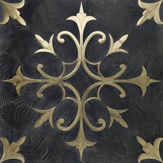 an intricately designed metal plate with gold accents