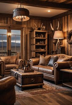 a living room filled with lots of leather furniture