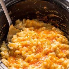 a crock pot filled with macaroni and cheese