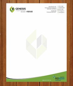 the front and back of a white letterhead with green accents on wood paneling