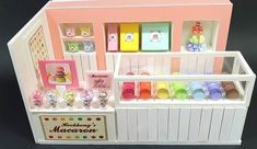 a toy store with lots of different items in the display case and on the shelf