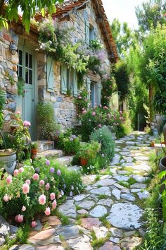 a cobblestone path leading to a stone house