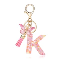 a pink key chain with a butterfly on it