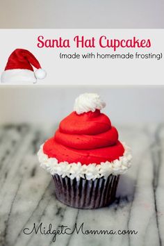 a red frosted cupcake sitting on top of a marble counter topped with white icing