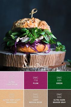 an image of a sandwich that is on top of a tree stump with color swatches