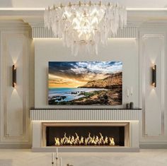 a living room with a fire place and chandelier