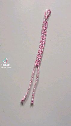 a pink and white rope is on the table