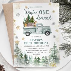 a birthday card with an image of a truck and christmas trees in the back, on top of a plate