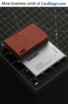 two business cards sitting on top of each other