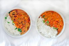 two white bowls filled with rice and meat