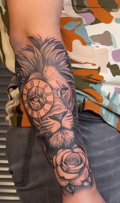 a man with a lion tattoo on his arm holding a clock and roses in front of him