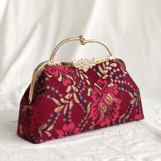 This Red Peony purse is made from a luxurious dark red Peony flower patterned lace, has both a hand clasps and long chain for convenient daily use and is great as a daily bag, or for a special occasion. **Along with the order, we will give you a free wallet made of the same fabric ：） --------------------------------- Details: Color: Dark red Peony flower pattern Fabric: Composite lace Capacity: Day to day items (phone, wallet, keys, lipstick, makeup bag etc) Function: hand held, shoulder or cros Red Peony, Unique Handbags, Pattern Purse, Red Peonies, Best Purses, Daily Bag, Embroidery Bags, Stylish Handbags, Lipstick Makeup