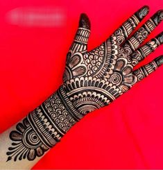 the hand is decorated with intricate designs