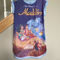 Nwt Disney’s Aladdin Vhs Cover Art Sleep Shirt Blue Disney Sleepwear, Blue Disney Tops For Disney Trips, Blue Disney Style Tops For Disney Trips, Disney Short Sleeve Sleepwear For Bedtime, Blue Crew Neck Sleepwear With Graphic Print, Disney Character Print Sleepwear, Casual Bedtime Tops With Character Print, Short Sleeve Cartoon Print Sleep Top, Blue Graphic Print Sleep Top