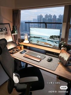 a desk with a computer monitor, keyboard and mouse on it in front of a window