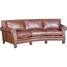 a brown leather couch sitting on top of a white floor